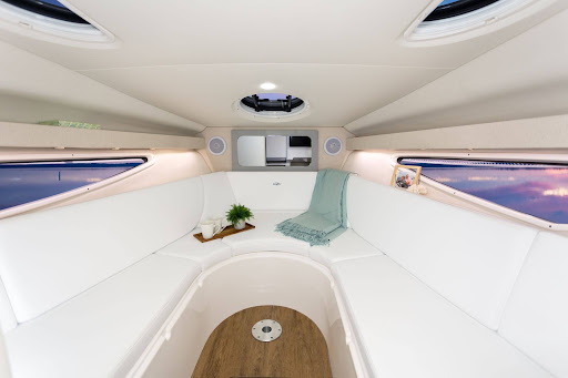 Professionally cleaned boat cabin with bright upholstery and finished interior surfaces.