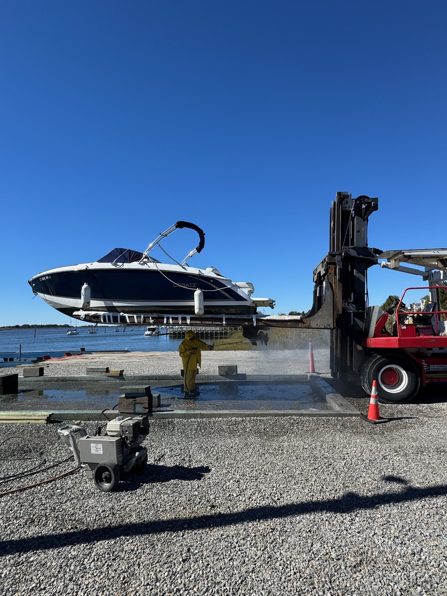 A boat being shrink-wrapped for winter storage