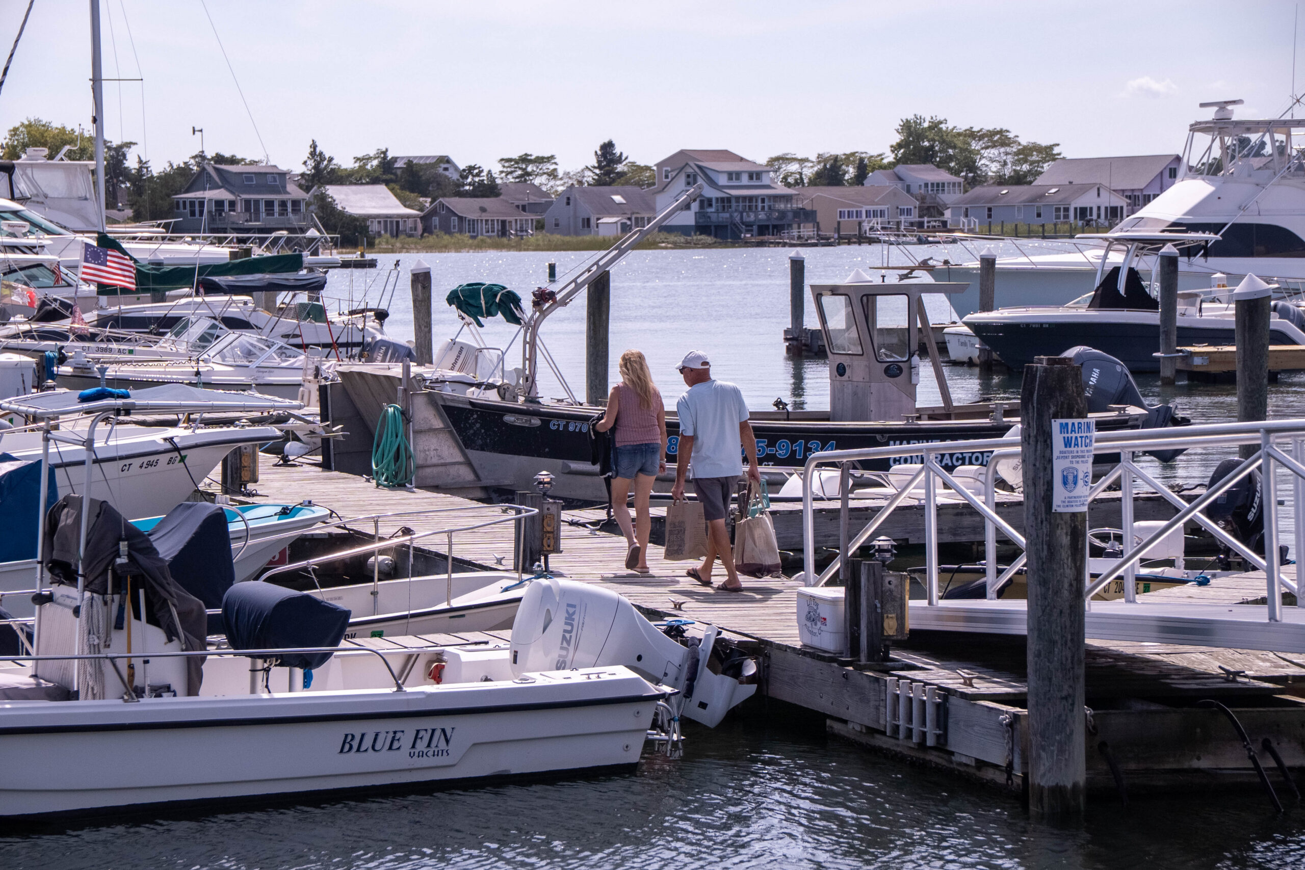 Picnic tables and umbrellas on the waterfront at Petzold's Port Clinton Marina